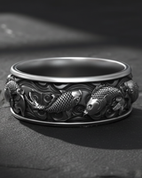Detailed 925 sterling silver koi fish ring featuring Japanese carp swimming in waves on dark textured surface