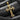 Close-up of byzantine style silver cross showing granulated details and black gemstones