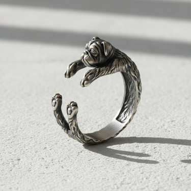 Angled close-up of sterling silver bulldog ring highlighting oxidized finish and intricate animal jewelry design