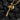 Angled shot of handcrafted silver axe pendant with gold accents showing wood grain texture on handle