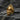 Gold variant of the tentacle skull ring displayed on rock to showcase alternative finish and detailed design