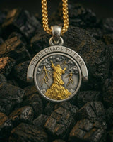 Silver Stormborn Climber Pendant's 'Chaos' side, featuring a gold-plated figure on a peak with lightning bolts.