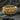 Gold vermeil baroque cross ring featuring alisee cross and floral scrolls on textured rock background