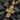 Gold plated variation of the Orthodox cross pendant displayed on dark textured background highlighting religious details