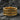 Gold vermeil gothic cross ring with heraldic lily details displayed on dark stone background