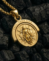 Gold vermeil Resurgent Knight pendant showing standing warrior and Fall Then Rise text on charcoal