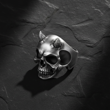 Top down perspective of demon skull ring highlighting cracked forehead detail around horns and sterling silver shine