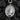 Silver veritas pendant necklace showing detailed relief work and saint design on dark texture