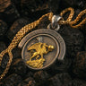 Front detail of the Silver Resurgent Knight Pendant with a gold-plated griffin holding a sphere, set on a dark silver coin.