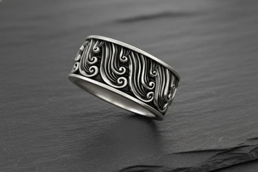 Side view of handcrafted silver wave ring showing the continuous relief pattern and oxidized finish depth