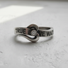 Side view of 925 sterling silver promise ring with engraved text and wrapping heart design