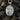 Angled shot of silver archangel Uriel necklace pendant highlighting the relief craftsmanship and ST. URIEL text