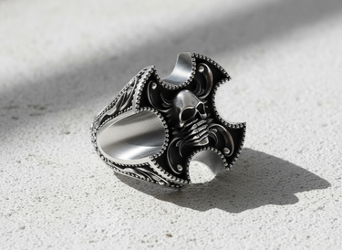 Side profile of silver gothic skull ring showing heavy band thickness and detailed relief work