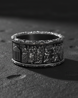 Angled shot of biblical silver ring featuring Saint Peter and Keys of Heaven scene with oxidized finish