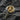 Detailed macro shot of Jesus Christ face on religious ring highlighting the relief carving and signet shape design