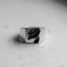 Front view of 925 sterling silver rift ring showing deep geological slate texture on signet face