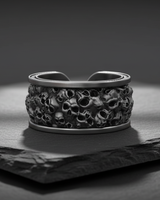 Angled shot of gothic skull ring highlighting the deep texture and ossuary inspired metalwork