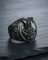 Side view of the sterling silver pirate skull ring showcasing the detailed wind rose and anchor design on the ornate band.