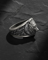 Side profile of sterling silver wolf head ring displaying high-relief carving and smooth interior band for comfort