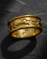 14K gold vermeil over silver bull ring featuring continuous charging taurus design on slate background
