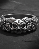 Front view of handcrafted 925 sterling silver baroque skull ring featuring rammed horns and acanthus leaves