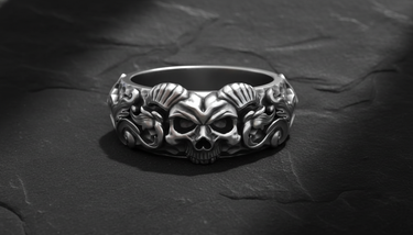 Front view of handcrafted 925 sterling silver baroque skull ring featuring rammed horns and acanthus leaves