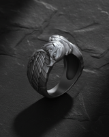 Angled shot of sterling silver eagle ring displaying the dual head design and sturdy band construction for men