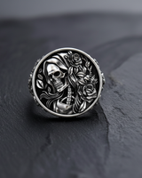 Front view of 925 sterling silver ring featuring a hooded skeleton skull surrounded by detailed blooming roses on black background