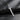Angled view of handcrafted fantasy sword pendant showing detailed metalwork and blade ridge