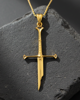 14K gold vermeil broken sword pendant featuring intricate elven hilt design on dark stone background