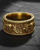 Gold variant of the skull and rose pattern ring showcasing intricate floral and memento mori design details