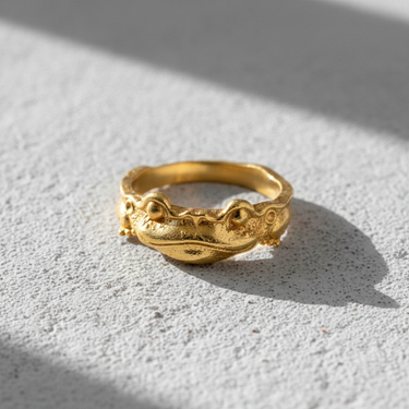 Angled view of cute frog ring design in sterling silver highlighting the detailed craftsmanship and unique fairytale style