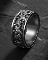 Close-up of Silver Rococo Band Ring showing raised ornamental borders and detailed botanical carving