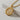 Silver Triquetra Pendant showing the 3D relief of the trinity knot and engraved border, angled on a light surface.