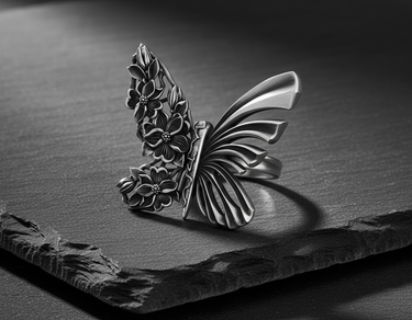Side view of silver metamorphosis ring showing detailed craftsmanship and floral texture