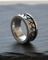 Close-up detail of dragon scales and spinner mechanism on premium sterling silver ring