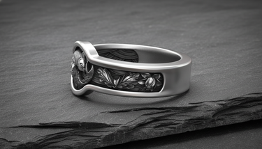 Side profile of sterling silver Japanese ornament ring displaying oxidized floral motifs and polished band thickness