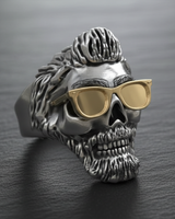 Front view of handcrafted 925 sterling silver biker skull ring featuring gold glasses and pompadour hairstyle