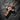 Detailed macro shot of 925 sterling silver cross pendant with gold vermeil finish and inset faceted gemstones