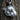 Close up of dynamic horse head design with wind-swept mane texture on sterling silver necklace pendant