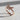 Diamond Butterfly Ring, rose gold, angled view on light textured surface