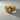 Acanthus Royal Lion Ring, front view on textured surface