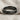 Diagonal Twist Ring, black rhodium, horizontal side view on fabric