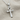 Beveled Ankh Pendant, polished, angled view on fabric