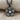 Five Petal Diamond Flower Pendant, black rhodium plated, front view on fabric