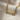 Elegant 925 sterling silver safety pin necklace with oxidized silver and gold finish resting on soft beige fabric