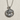 Virgo Zodiac Medallion Pendant, polished silver, front view on textured surface