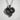 Horse Heart Pendant, black rhodium, front view on textured wall