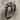 Wrap bat wing ring, black rhodium plated, angled view on fabric