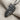 Double Horse Skull Pendant, oxidized silver, close-up angled display